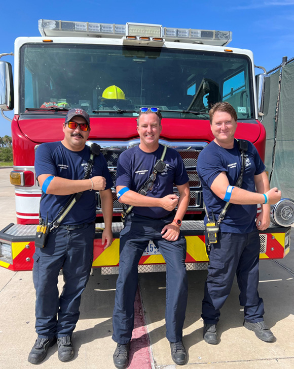 Firemen showing they donated blood