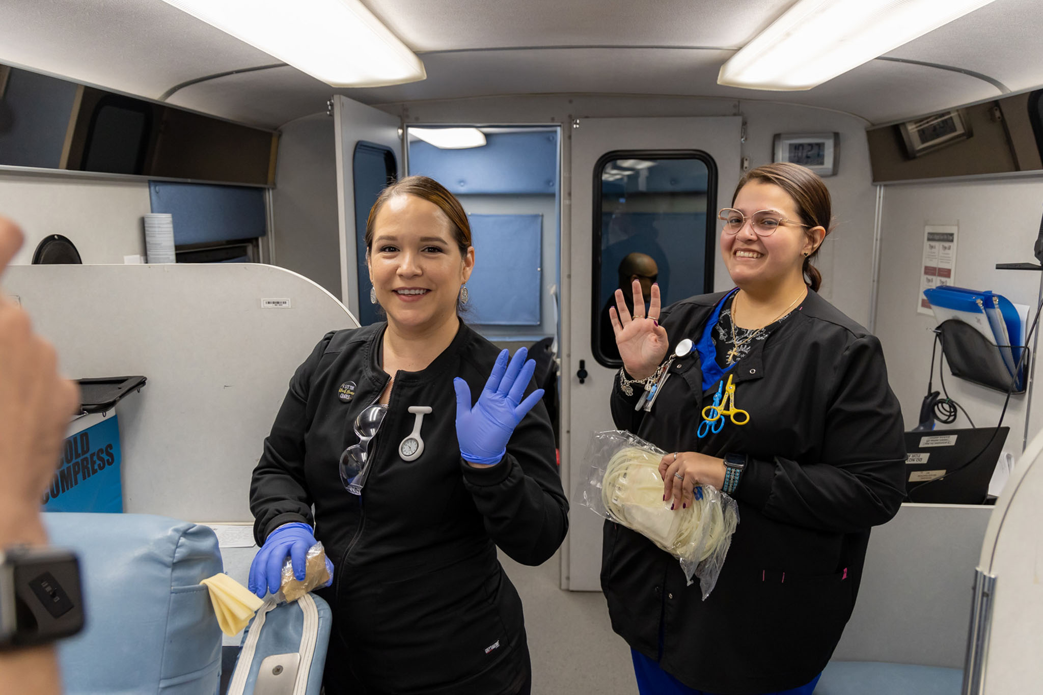 Two Technicians prepping to help with donations