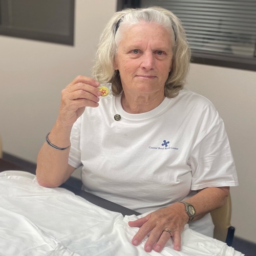 volunteer helping with shirts
