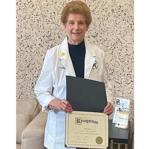 Volunteer holding certificate